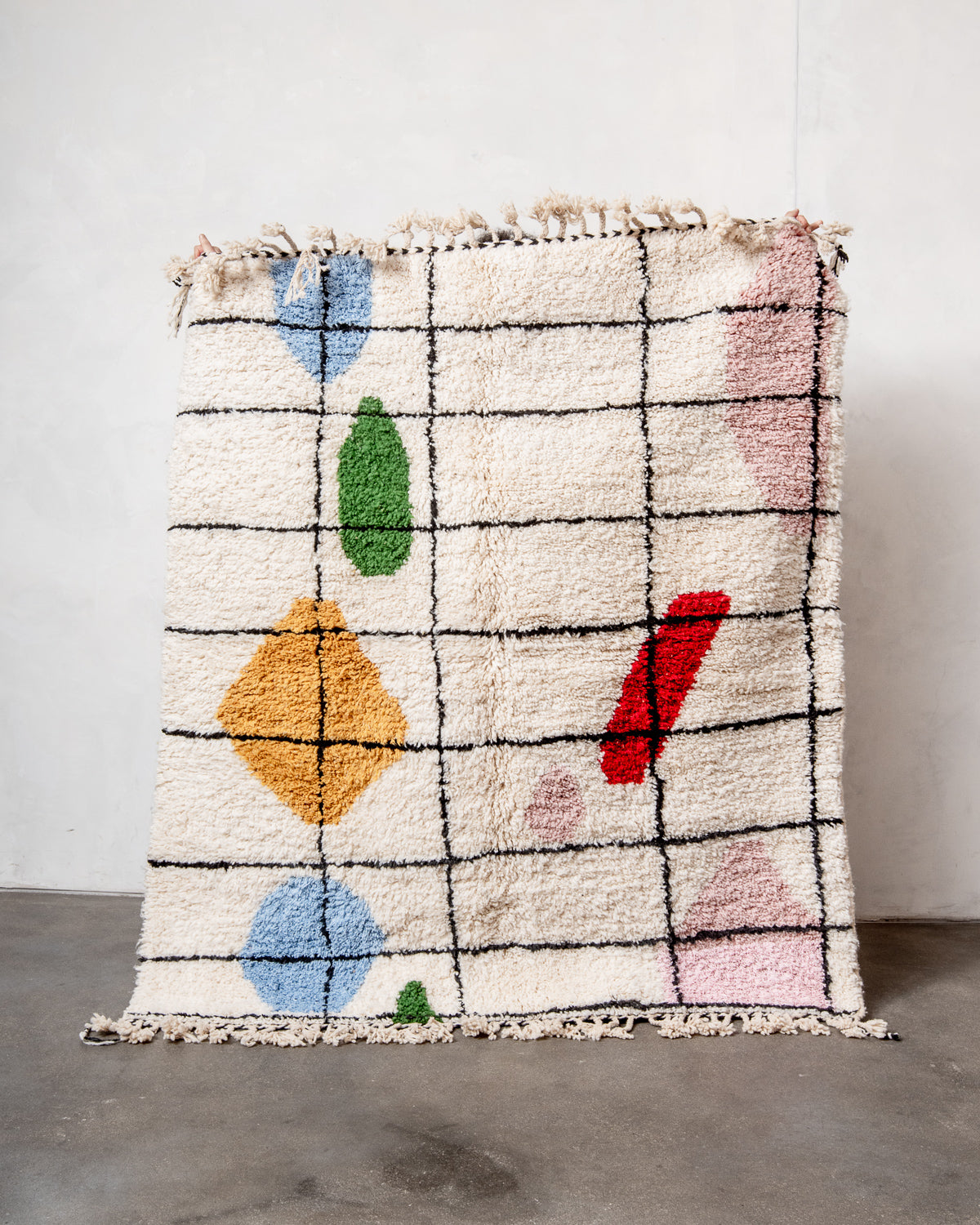 Modern, designer, handcrafted Berber rug from Morocco. Beniourain carpet with beautiful colours and patterns and fluffy wool texture.